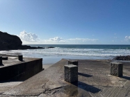 Sea view with concrete bollards in foreground